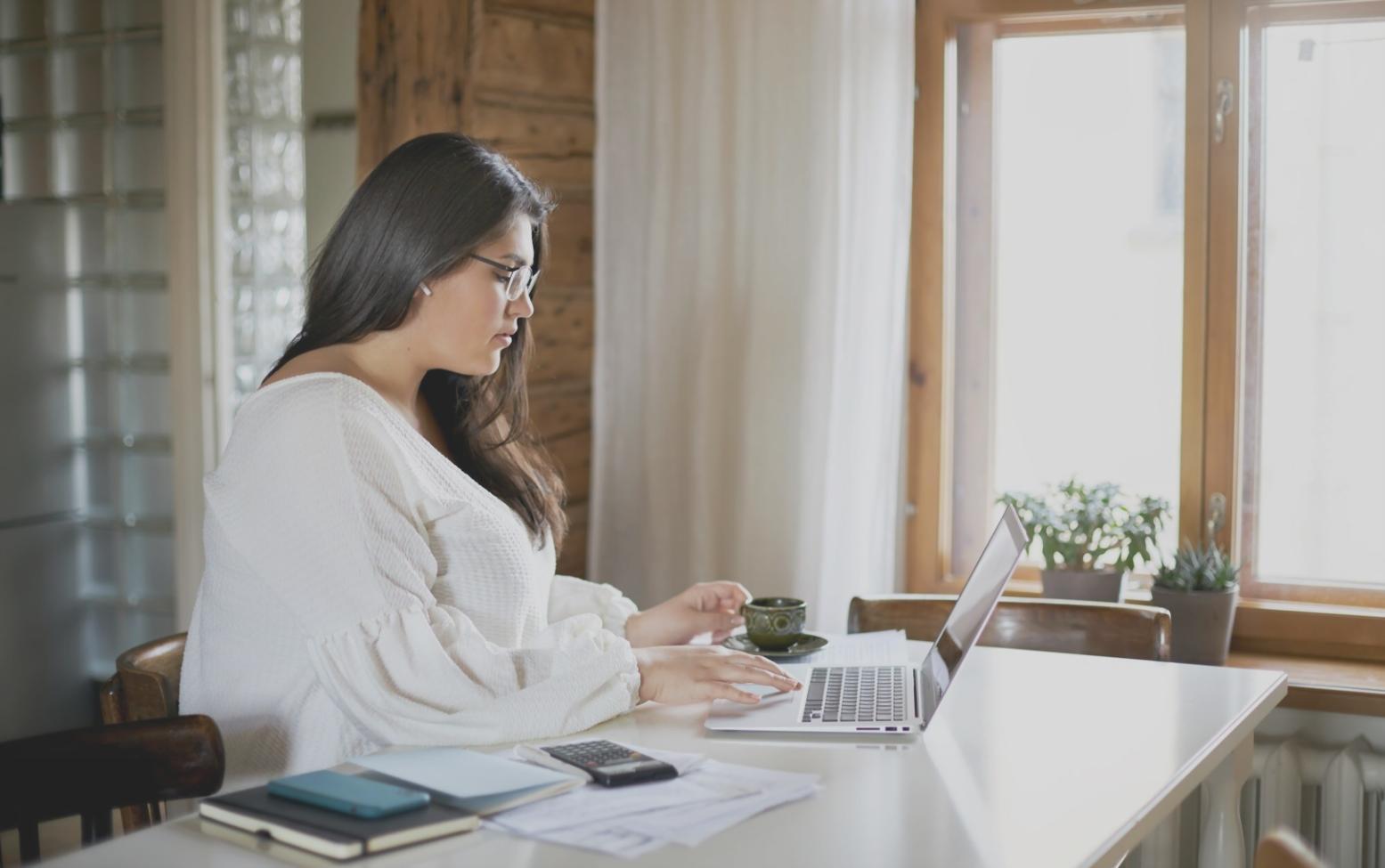 Professional using seasonal financial planning tools and calculators